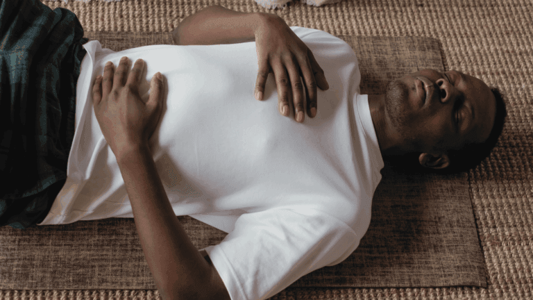 A man practicing breathing exercises