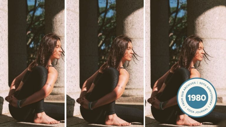 Woman practicing Marichyasana III outdoors.