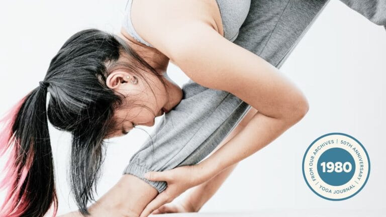 Close-up of woman practicing Parsvottanasana.