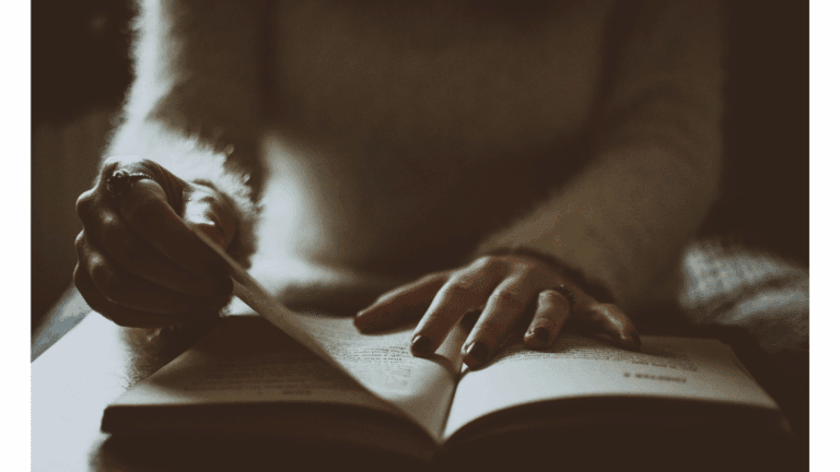 Woman flipping the pages of the best books 2025.