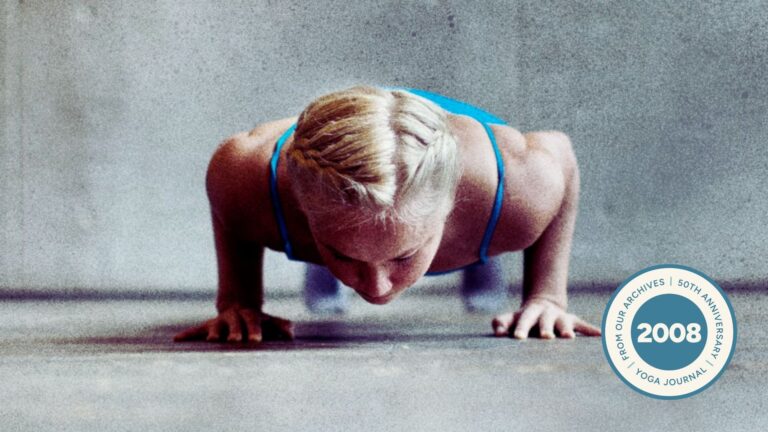 Woman practicing Chaturanga