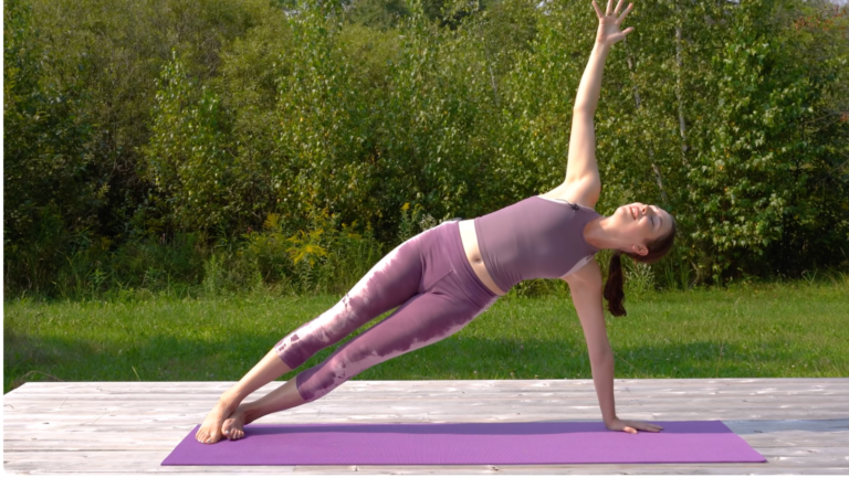 Woman in a yoga for core strength workout in Side Plank