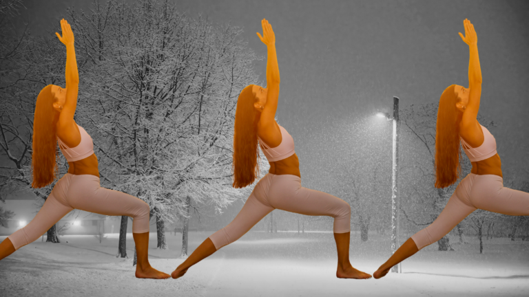 A woman in Warrior 2 against a snowy landscape, part of a yoga practice to banish the winter blues