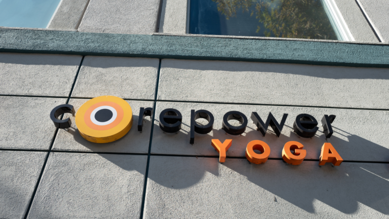 The CorePower Yoga logo on the side of a building