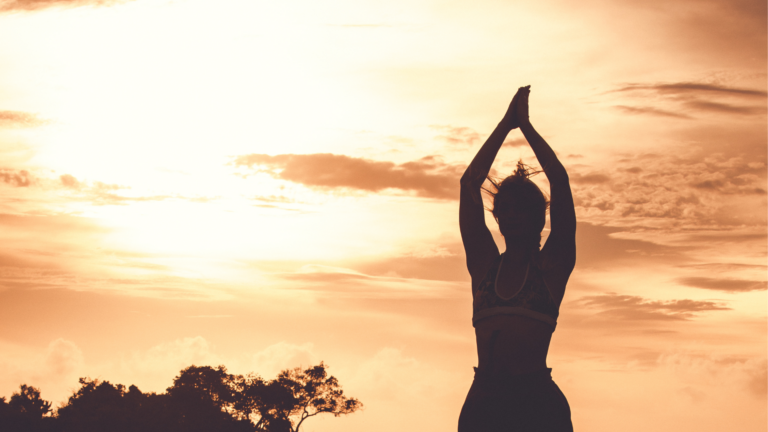 Woman outside at sunset