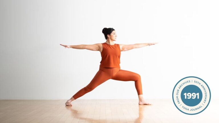 Woman practicing Warrior 2.