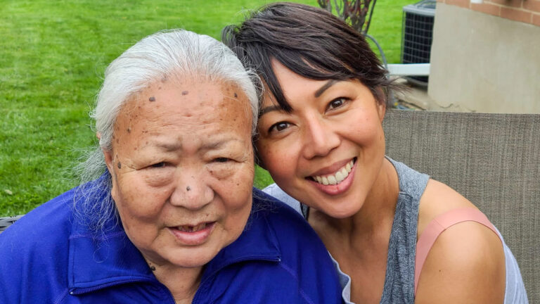 Author Chokey Tsering, smiling, and hugging her mother.