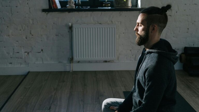 Image of man meditating in Easy Pose.