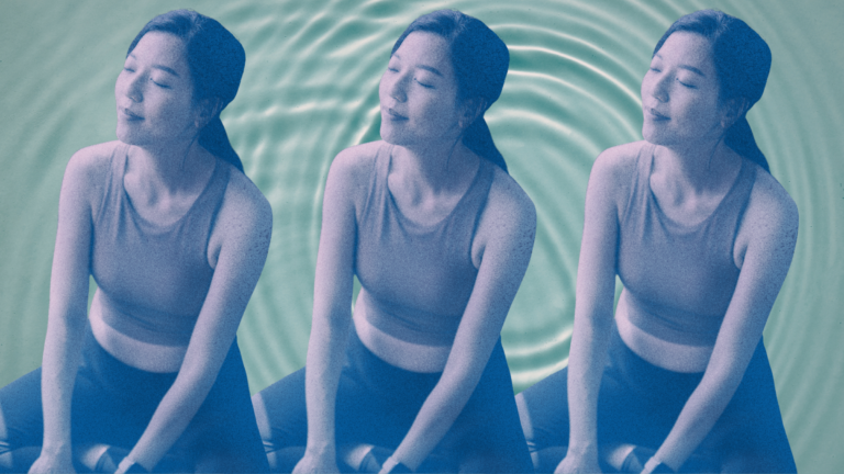 A woman sitting calmly against a water backdrop